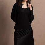 a cashmere lace cardigan sweater in black  with black silk skirt