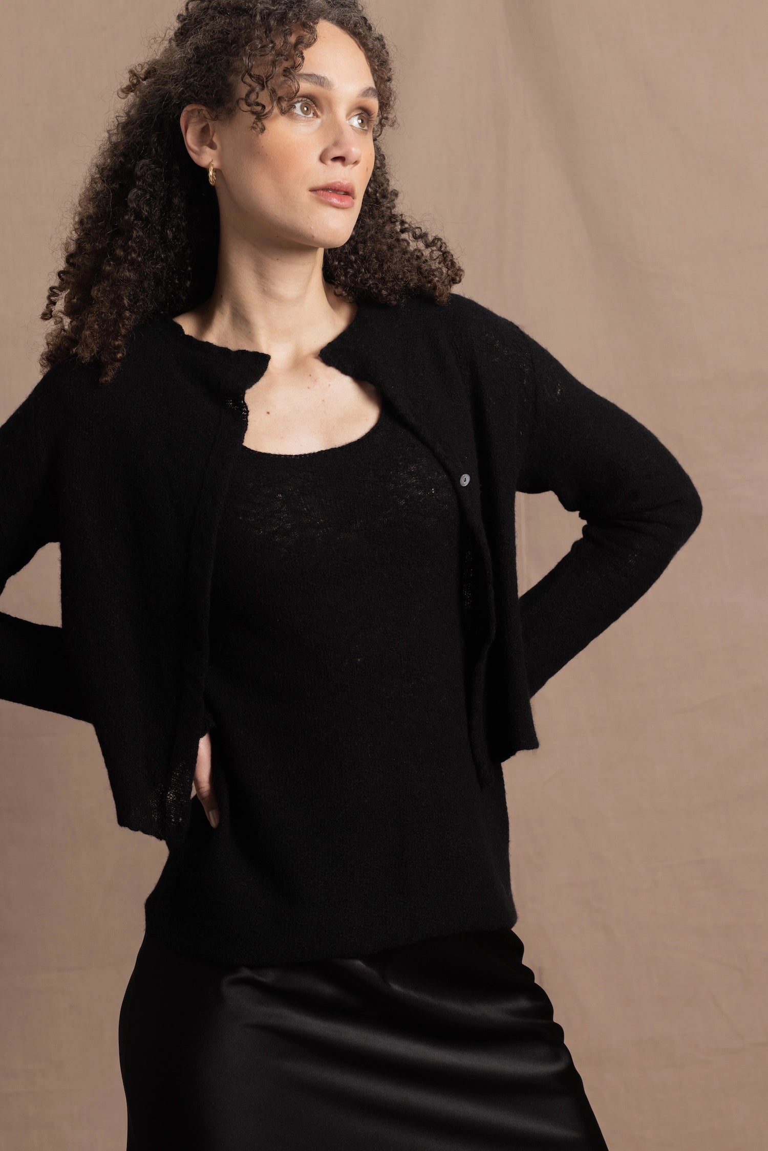 a cashmere lace cardigan sweater in black  with black silk skirt
