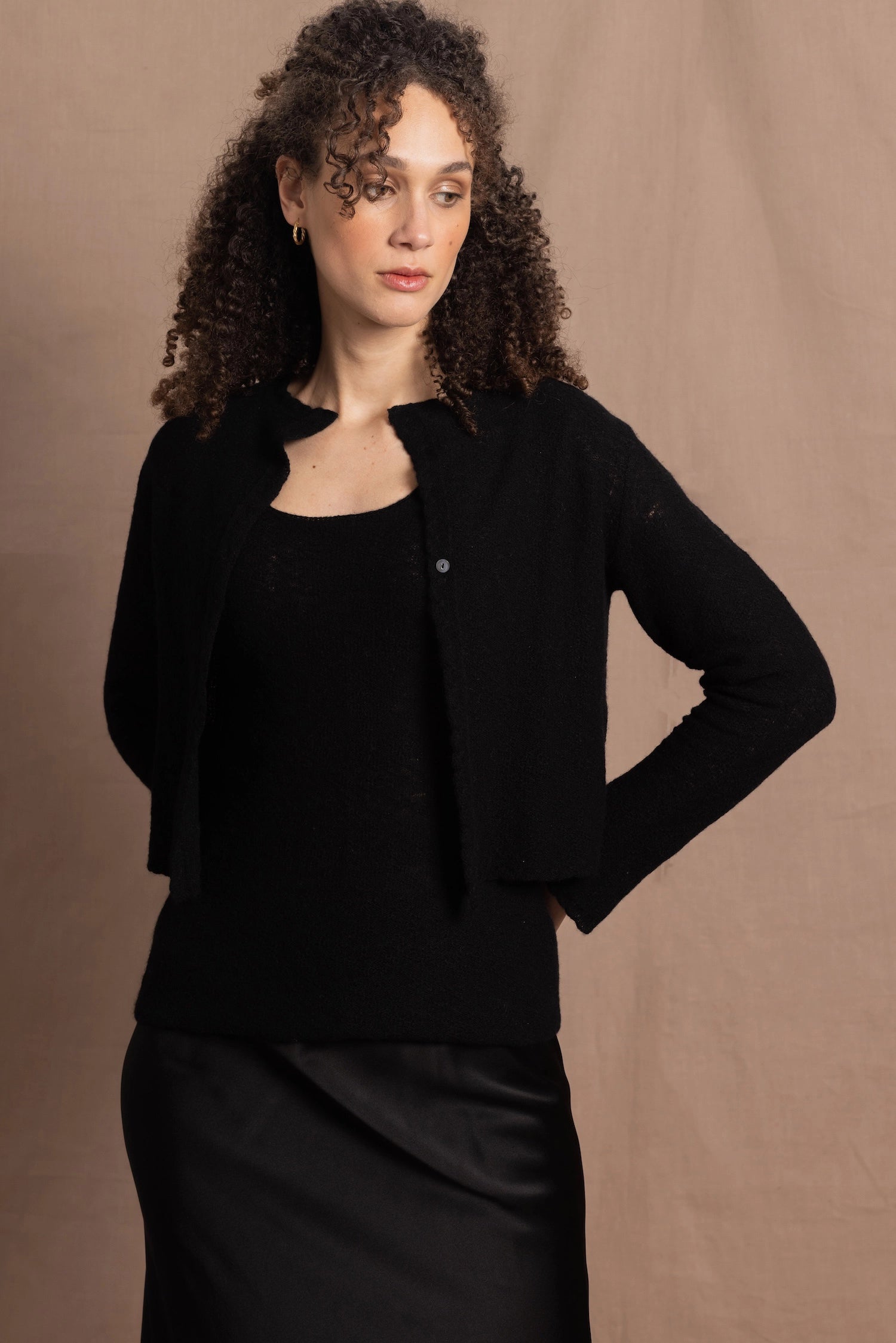 a cashmere lace cardigan sweater in black  with black silk skirt