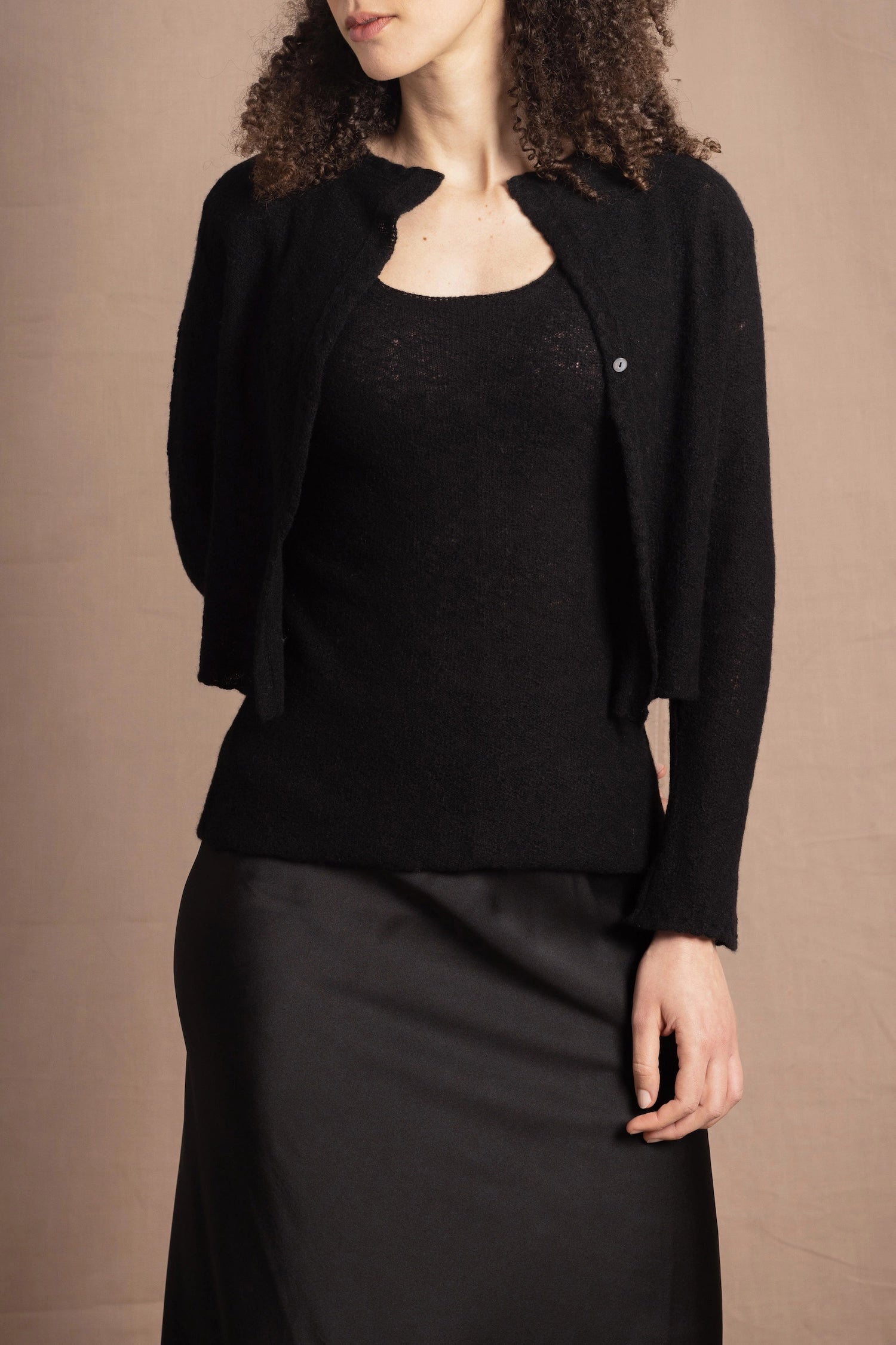 a cashmere lace cardigan sweater in black  with black silk skirt