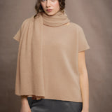 a woman wears a cashmere tee sweater in beige sandy colour