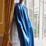 Woman in a luxurious blue silk dress