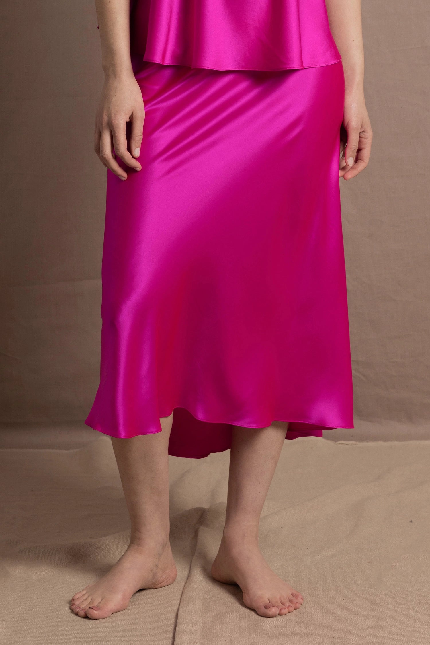A 100% silk skirt in bright shocking pink
