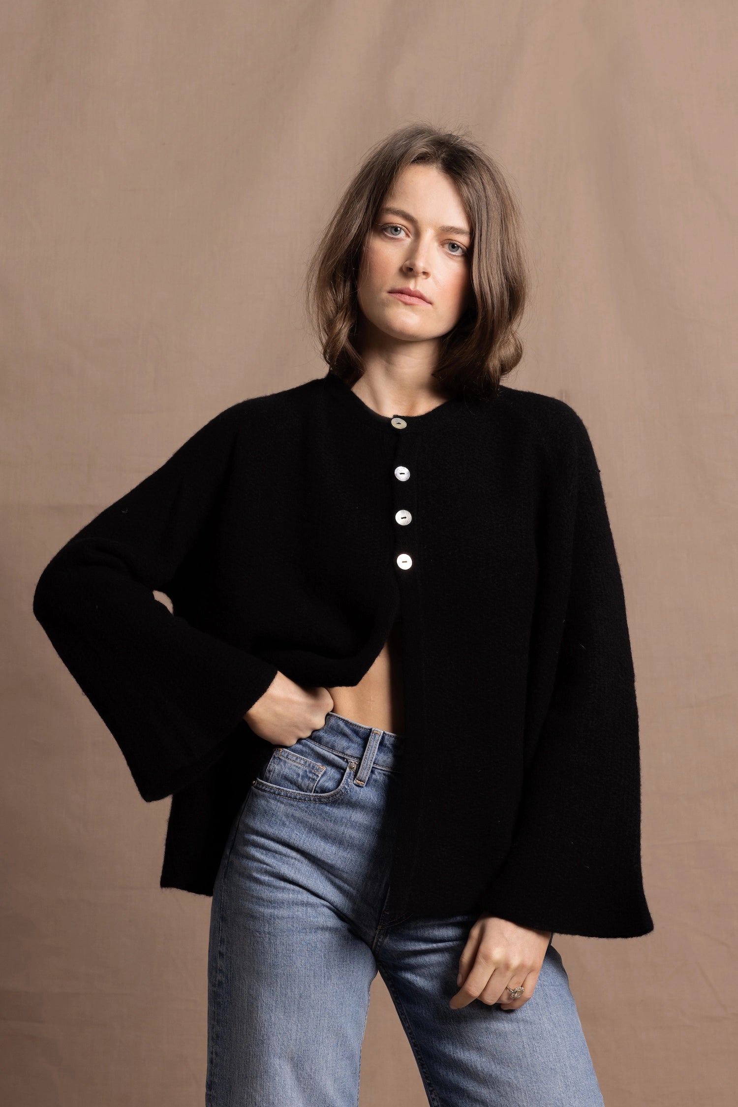 a 100% cashmere button down swing cardigan with moss stitch texture in black