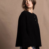 a 100% cashmere button down swing cardigan with moss stitch texture in black