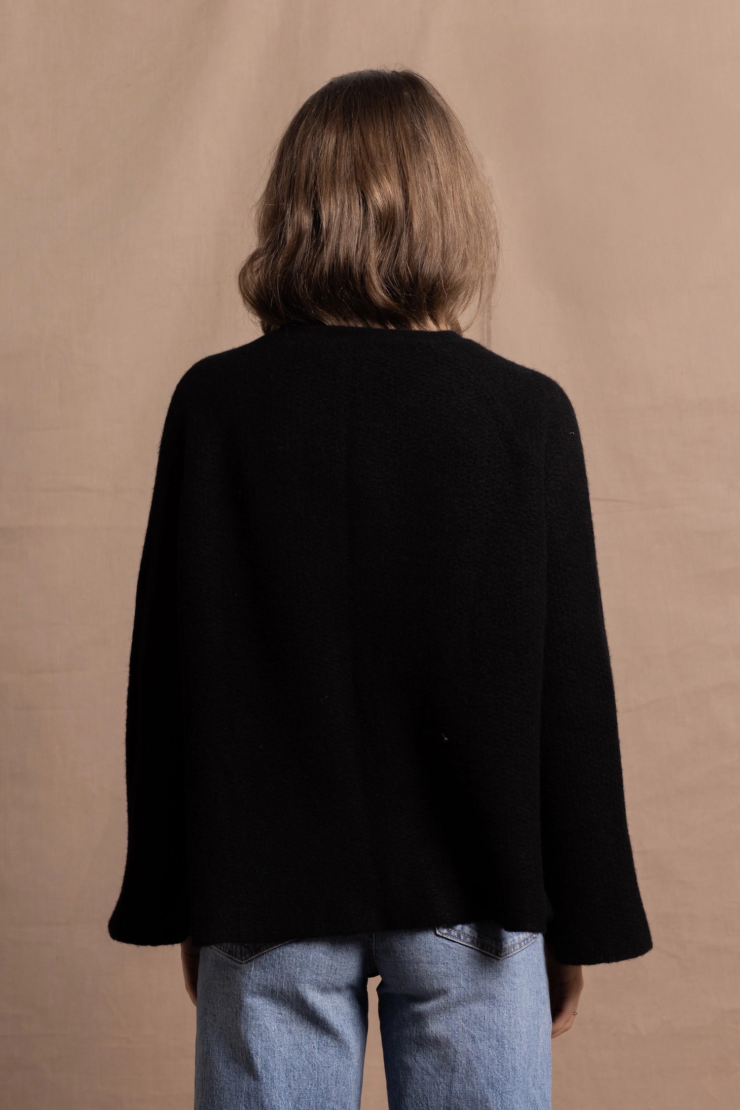 a 100% cashmere button down swing cardigan with moss stitch texture in black