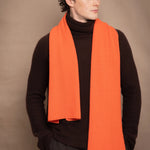 Man wearing an orange cashmere fisherman scarf
