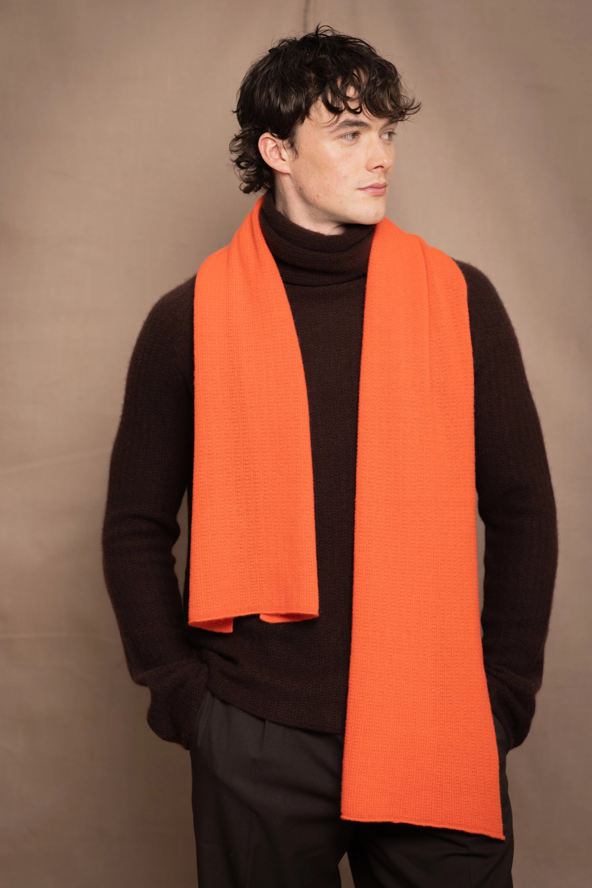 Man wearing an orange cashmere fisherman scarf