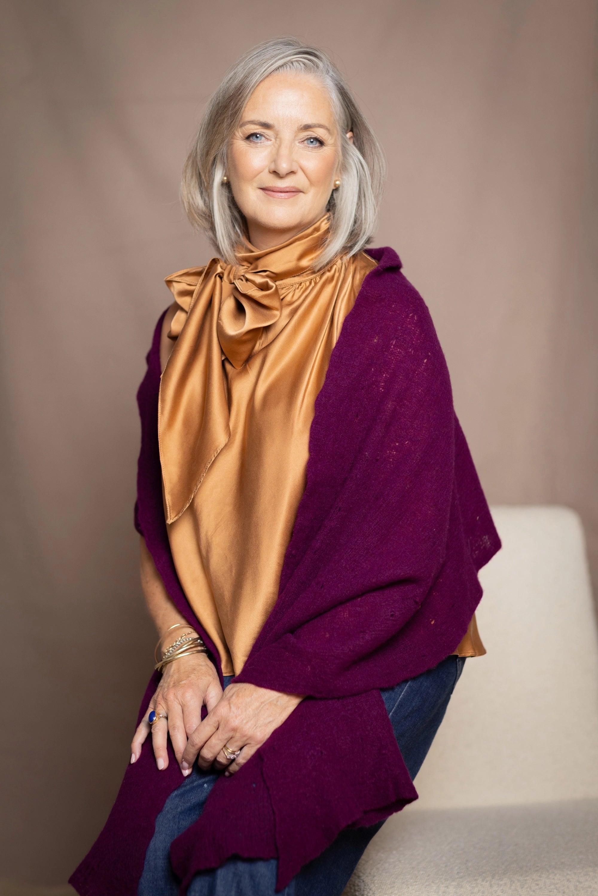 cashmere wrap shawl worn on top of a godl top