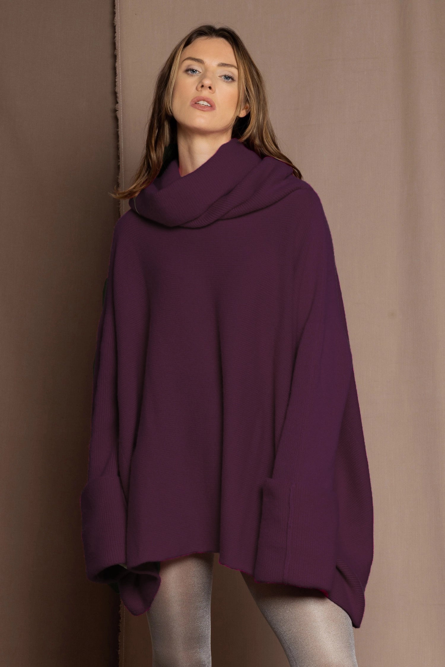 Woman wearing a purple cashmere sweater