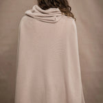 a woman wears an oversized 100% cashmere sweater in beige by Irish brand Madigan Cashmere