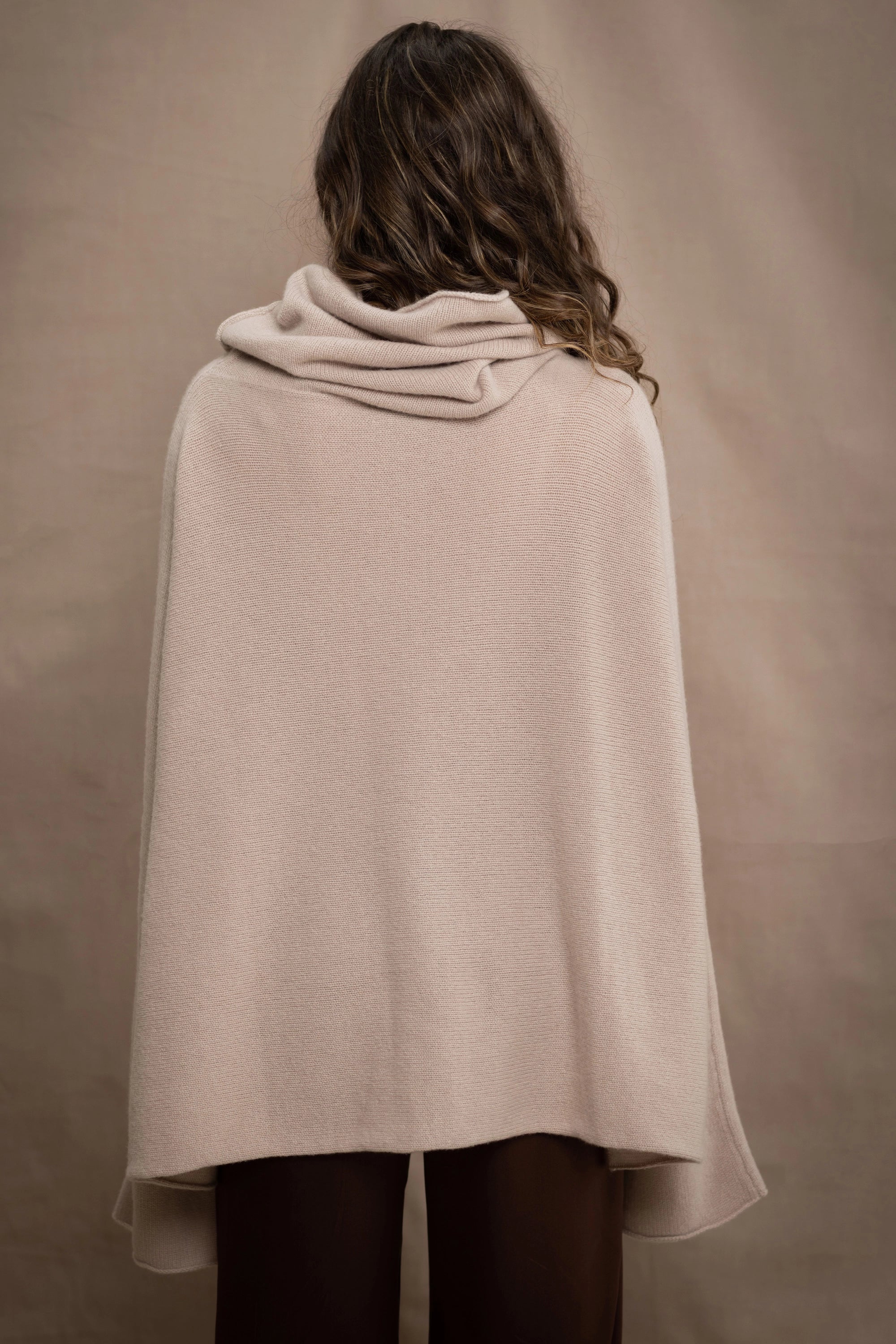 a woman wears an oversized 100% cashmere sweater in beige by Irish brand Madigan Cashmere