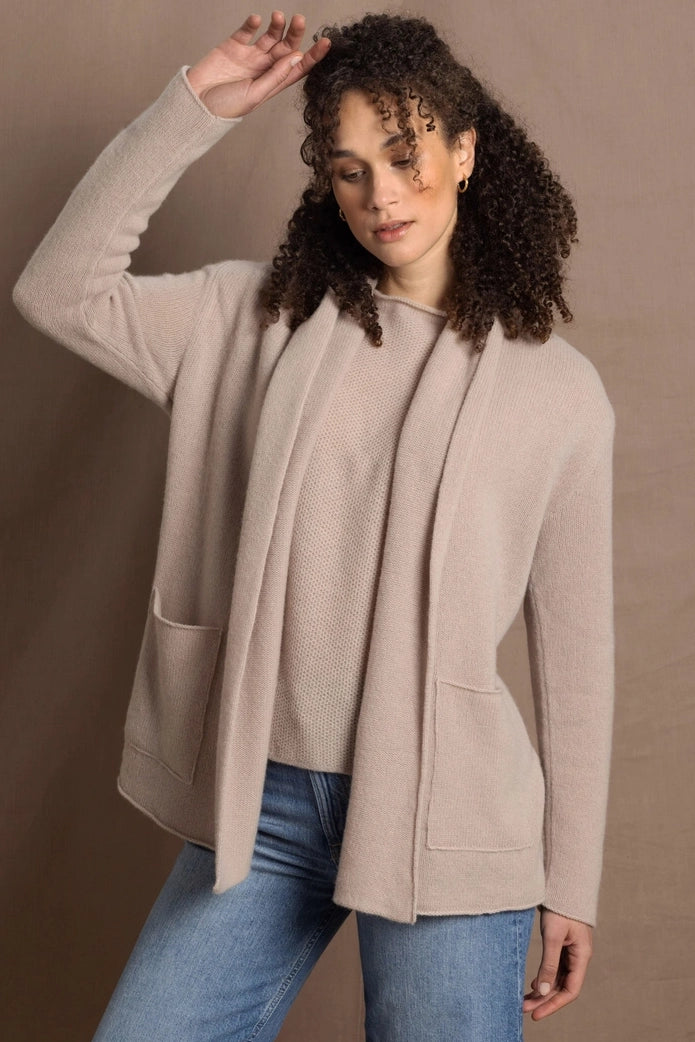 a woman wears a luxurious pure 100% cashmere cardigan