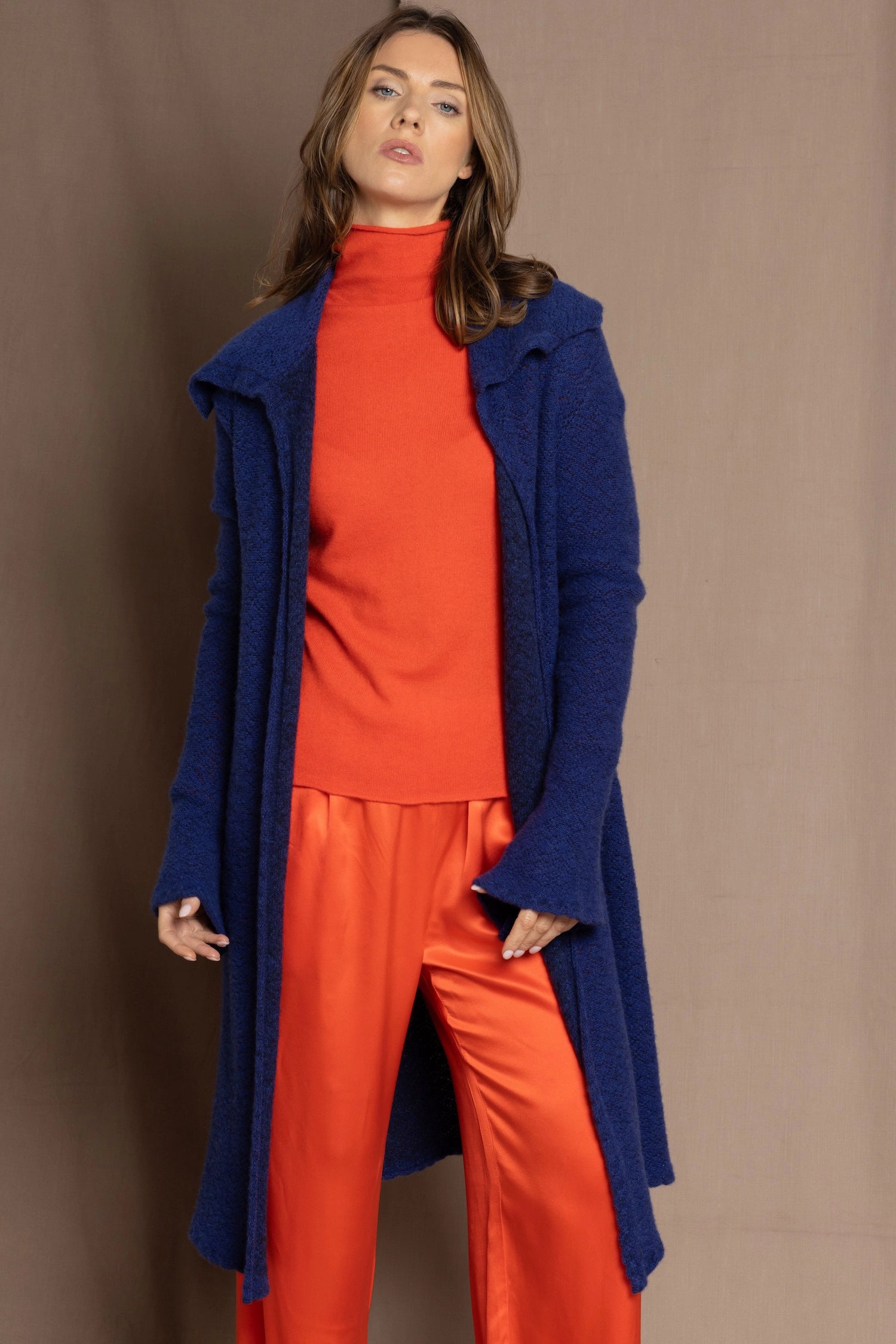 cashmere lace coat in blue over orange turtleneck and orange silk pants