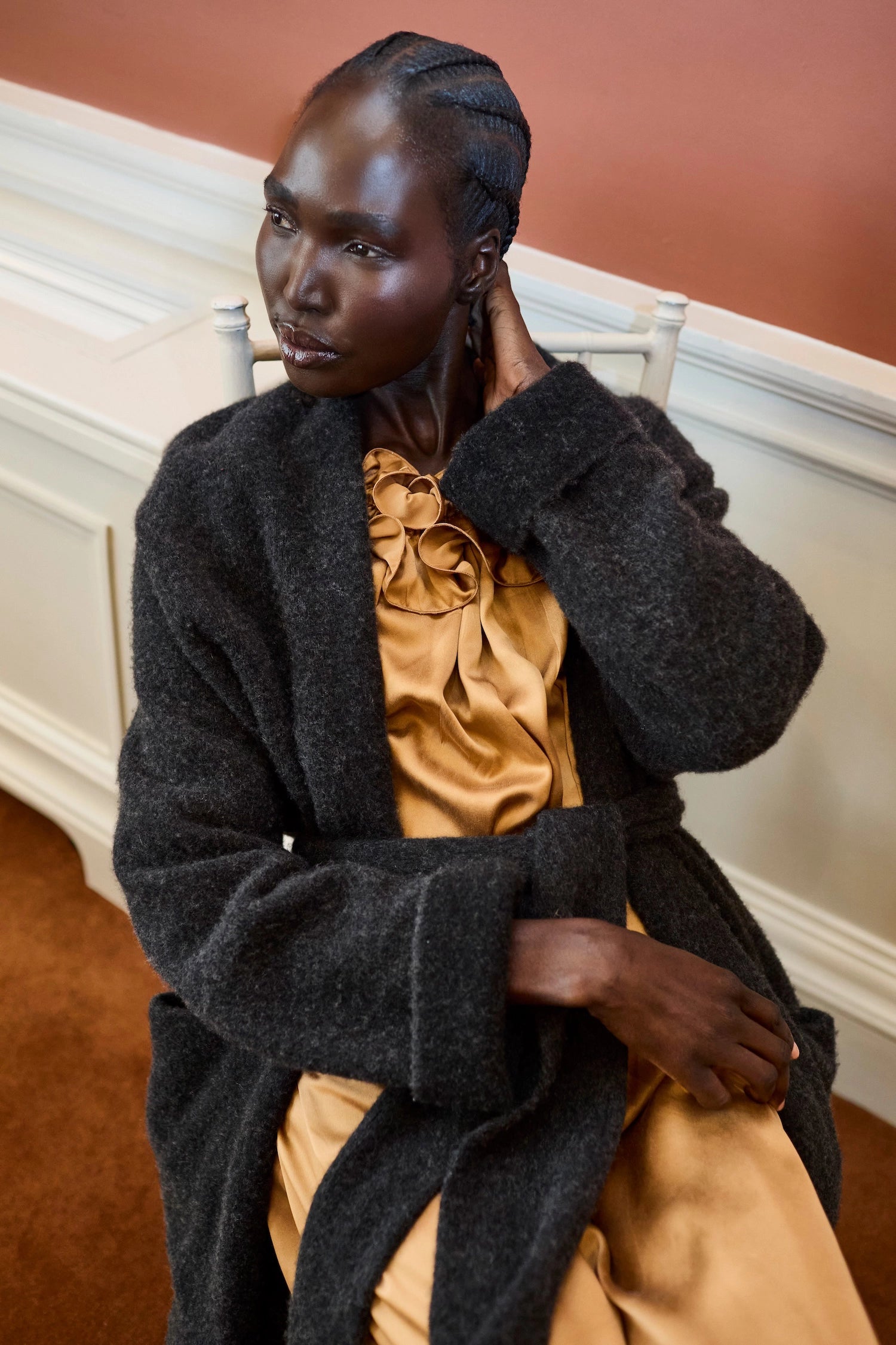 woman wearing a cashmere cardigan coat with a silk dress