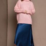 cashmere sweater in pink and blue silk skirt