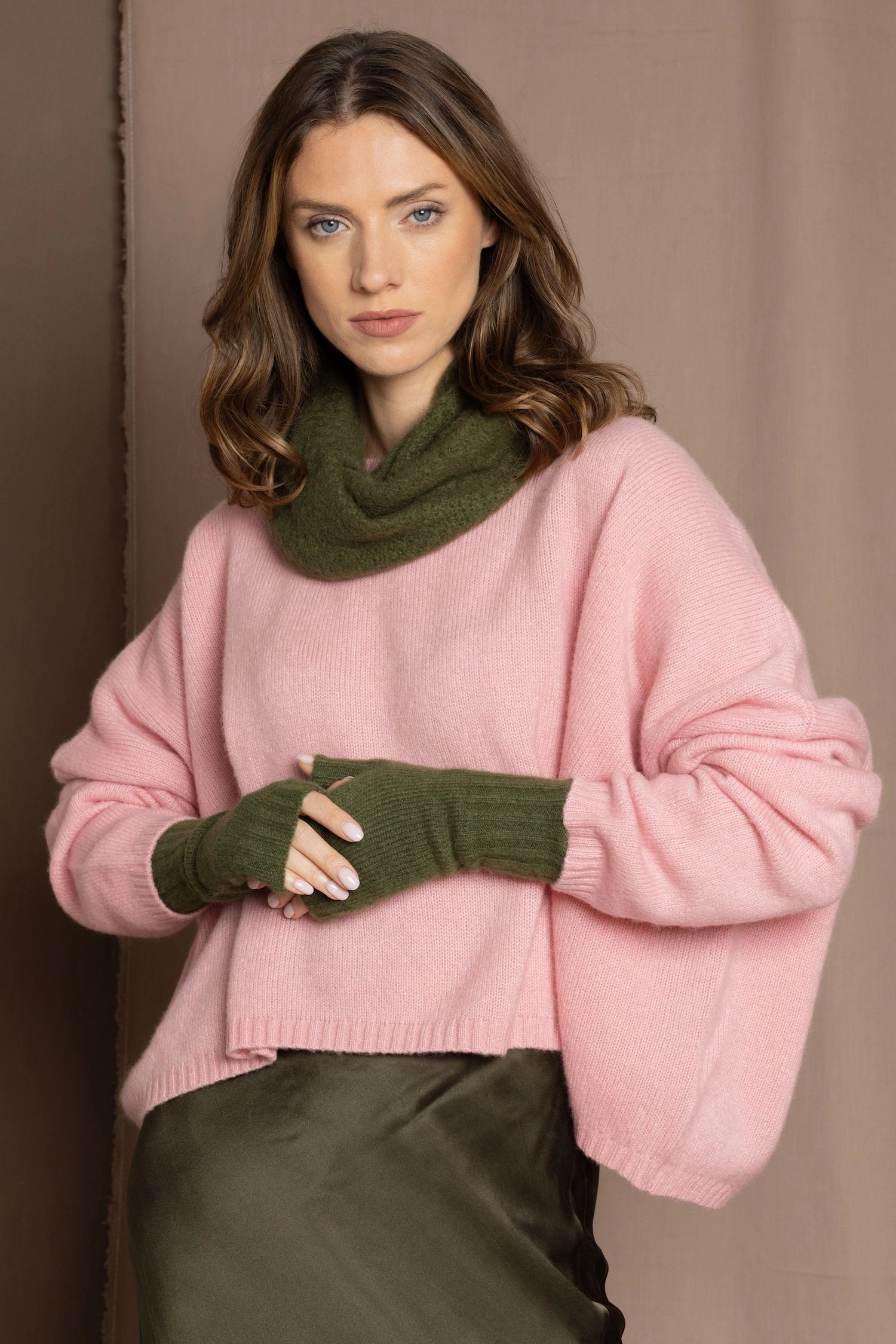 cashmere snood in green with matching green gloves and pink sweater