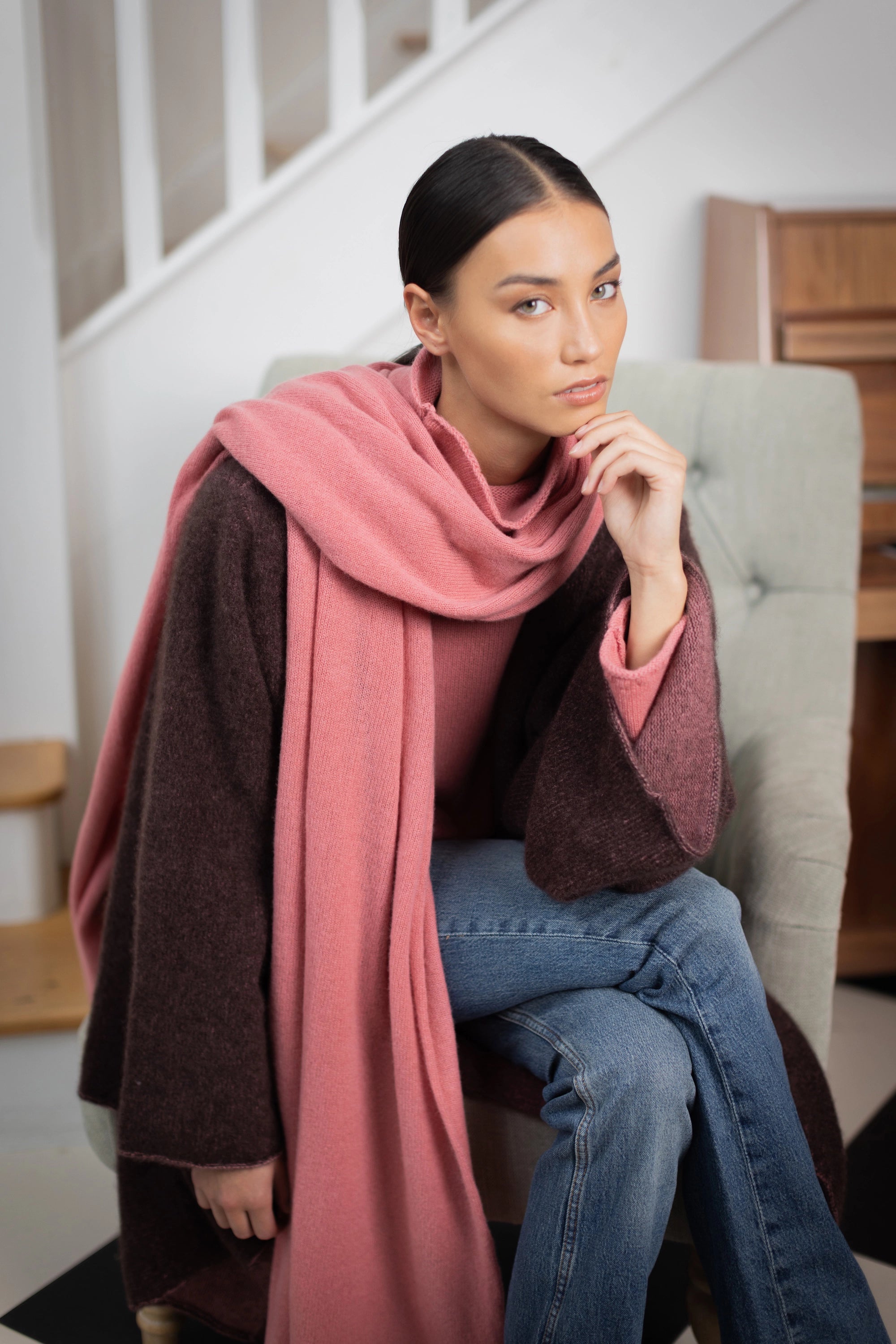 woman wearing a large cashmere travel wrap shawl in dusty pink rose 