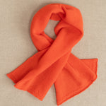 a small orange cashmere scarf 