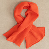 a small orange cashmere scarf 