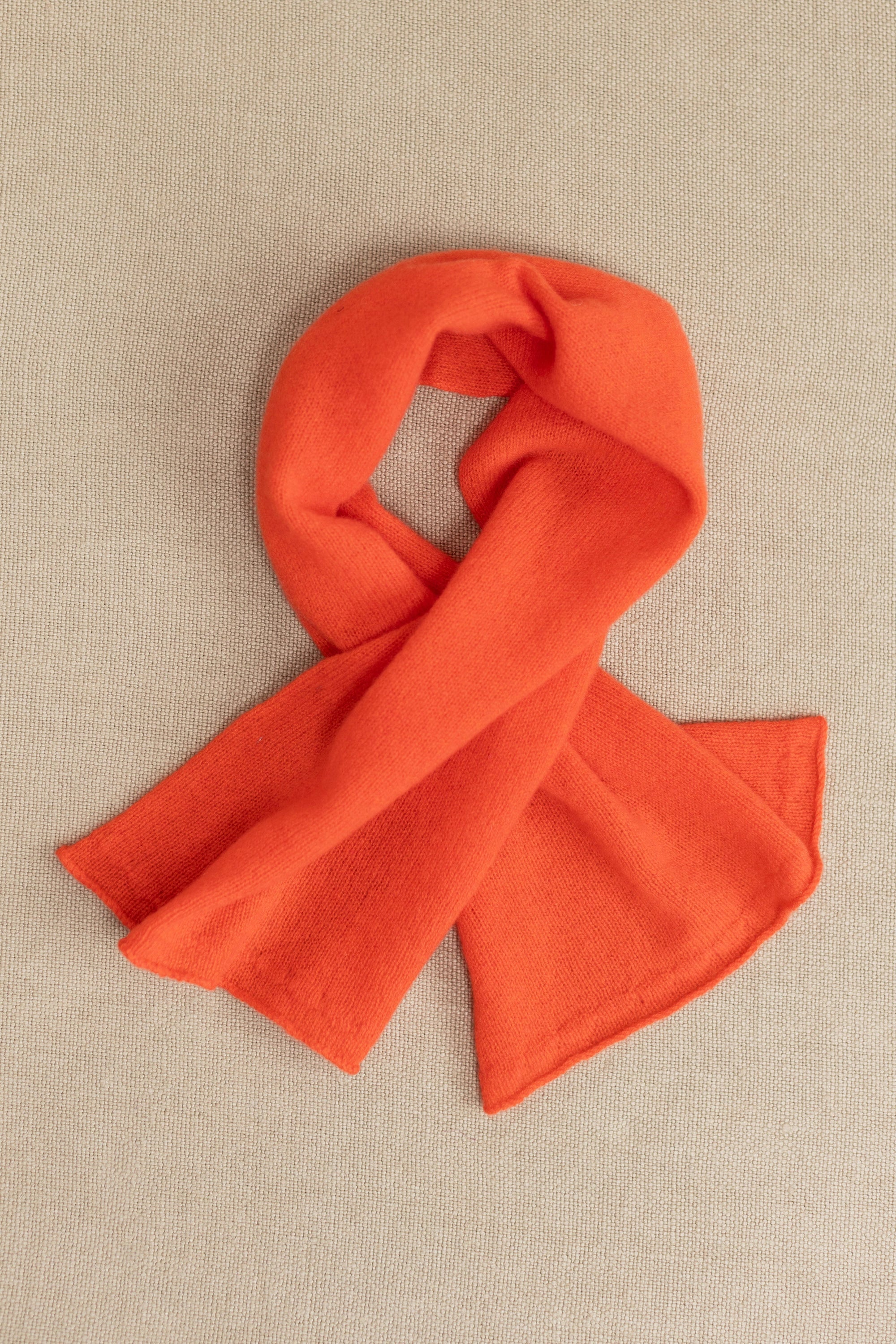 a small orange cashmere scarf 