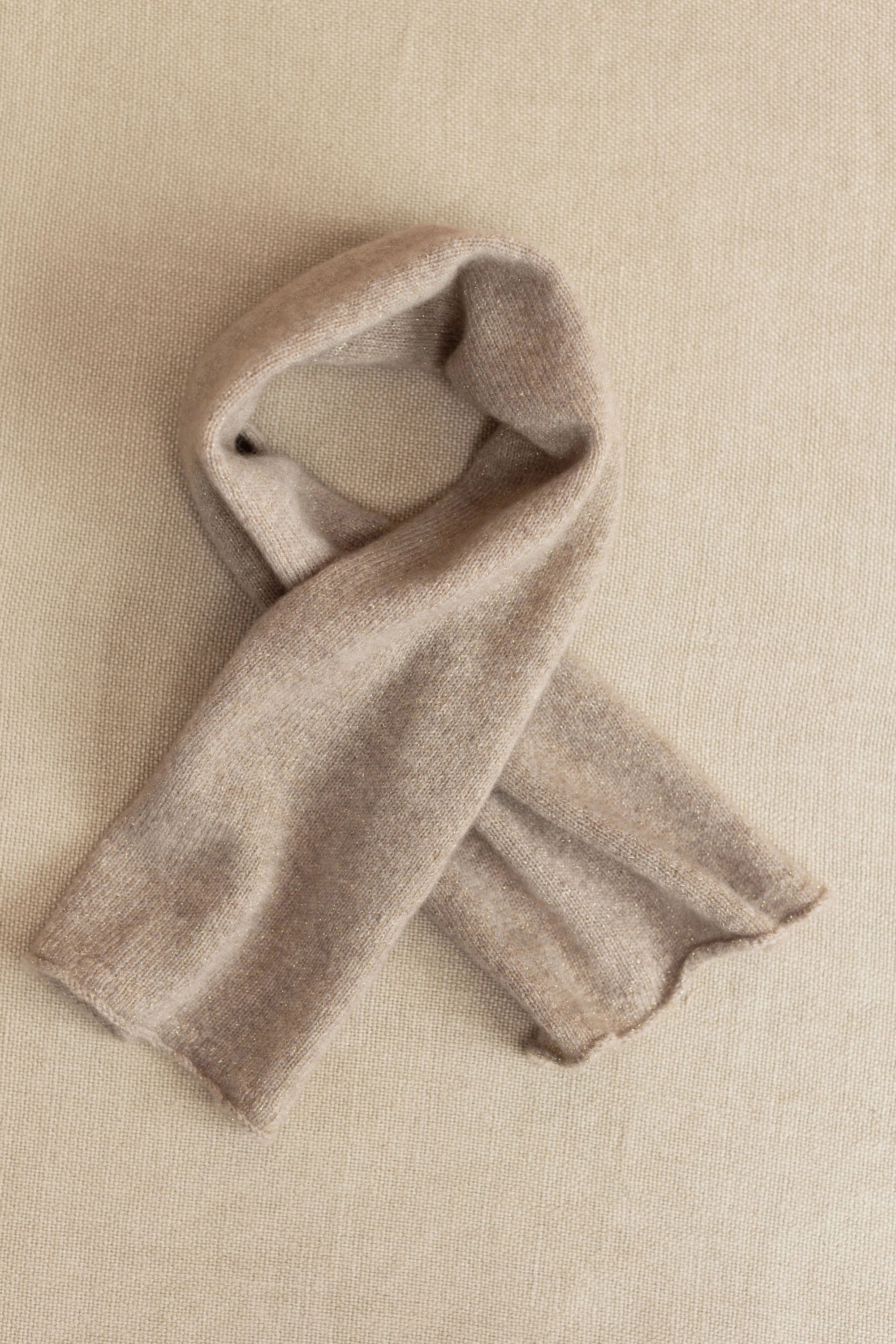 a small beige cashmere scarf 