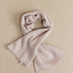 a small beige cashmere scarf 