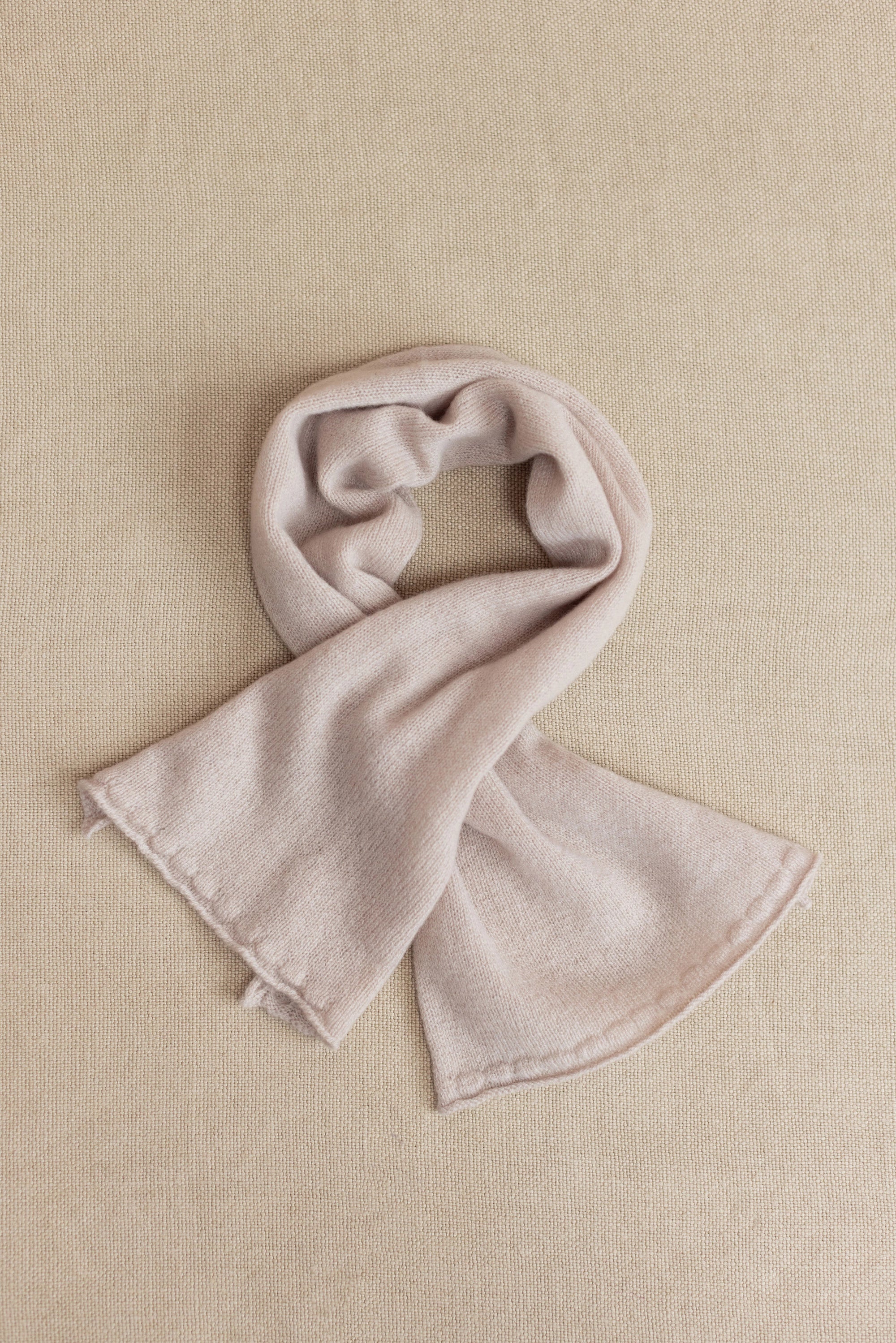 a small beige cashmere scarf 
