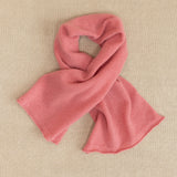 a small dusty pink cashmere scarf 