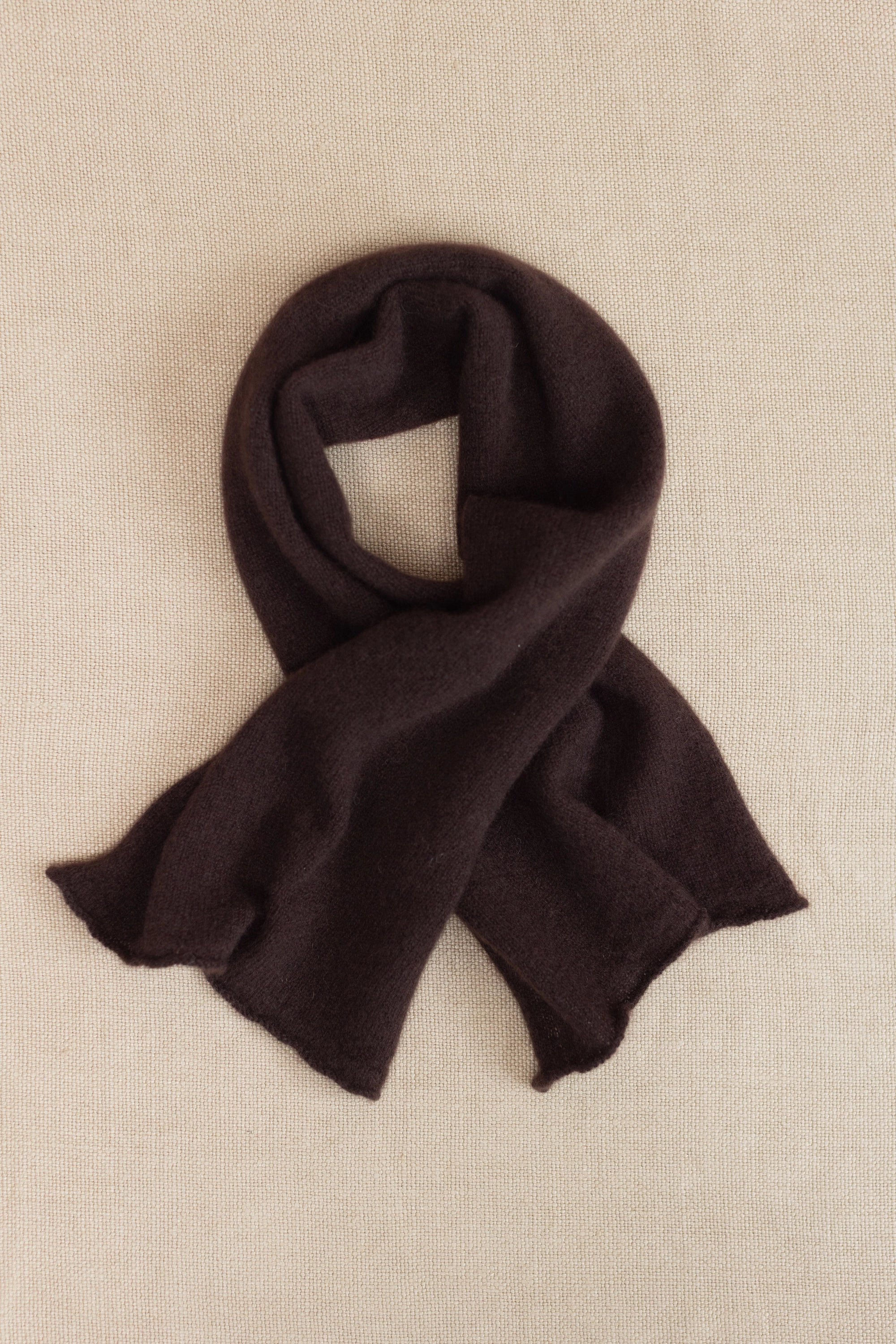 a small dark brown cashmere scarf 