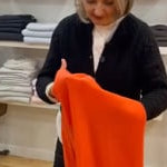 Elaine tries on Large Orange Wrap Scarf