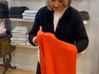 Elaine tries on Large Orange Wrap Scarf