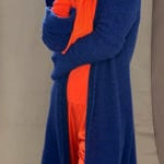 cashmere scarf and gloves in orange with bright blue cashmere coat