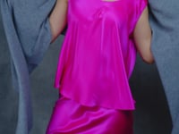 Lady wears large cashmere wrap shawl in Grey against bright pink silk top and skirt
