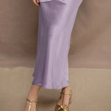 woman wearing a silk skirt in pale purple 
